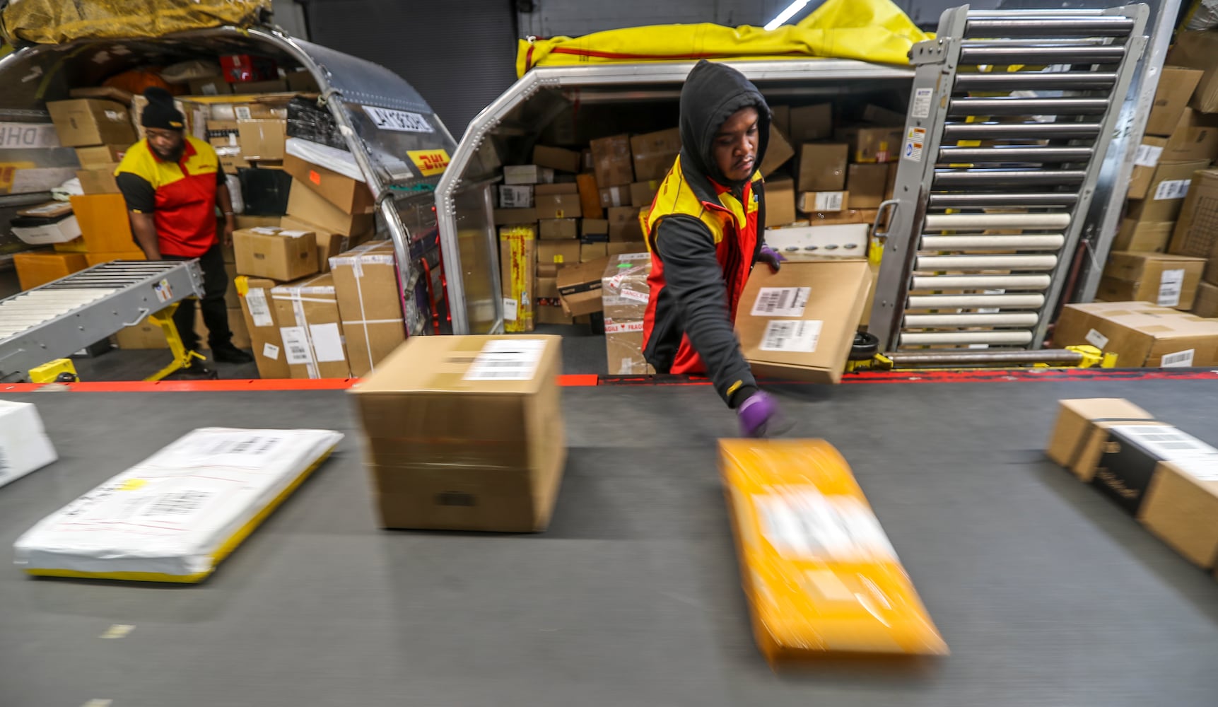 December 15, 2022 ATLANTA: Shawn Williams sorts packages readying them for transport. (John Spink / John.Spink@ajc.com)

