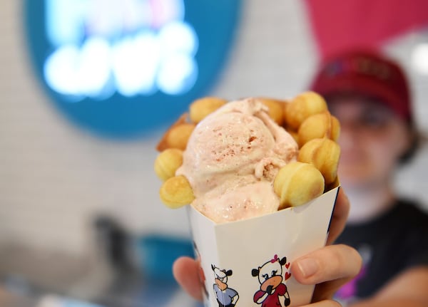 A Four Fat Cows ice cream cone is served up at Marietta Square Market. RYON HORNE / RHORNE@AJC.COM