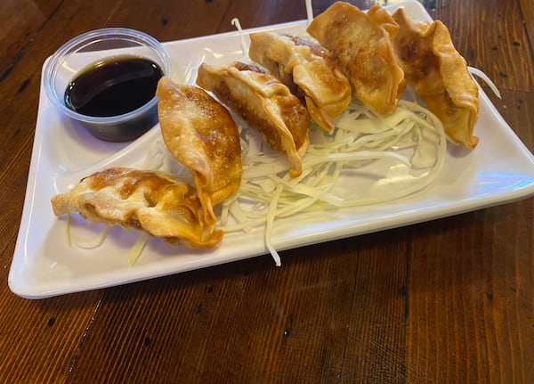 Fried dumplings are among the appetizers available at fast-casual Korean restaurant Chicken on Fire in Grant Park. (Ligaya Figueras/ligaya.figueras@ajc.com)