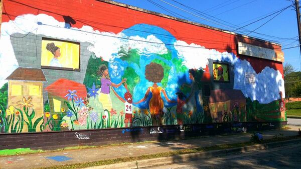 The Ashview Heights 125-foot mural on the side of the Fair Street Superette in southwest Atlanta.