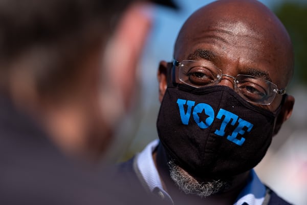 The coronavirus pandemic forced the Rev. Raphael Warnock to make changes both as a pastor and as a candidate for the U.S. Senate. Ben Gray for the Atlanta Journal-Constitution