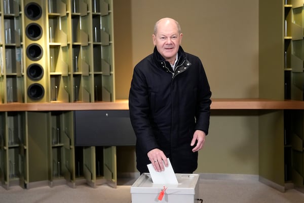 German Chancellor Olaf Scholz casts his vote at a polling station in Berlin, Germany, Sunday, Feb. 23, 2025, during the German national election. (AP Photo/Ebrahim Noroozi)