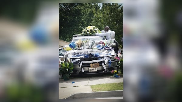 Mourners left behind flowers, balloons and notes about how much the deputy meant to them.