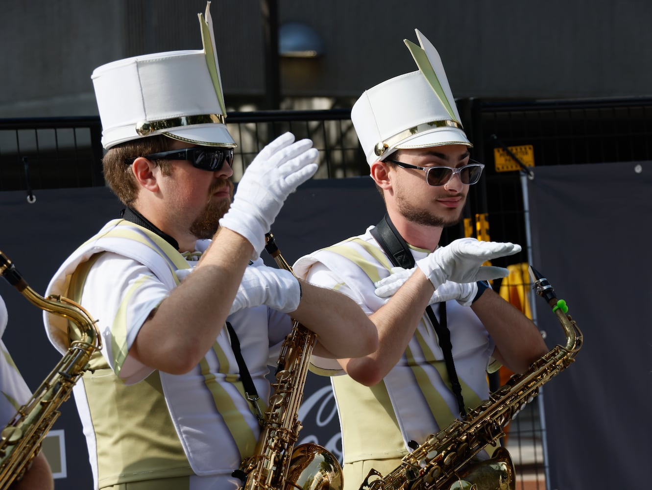 Matthew Babbitt (left) and Cody Bailey do the Macarana as they wait for the team to arrive.    (Bob Andres for the Atlanta Journal Constitution)