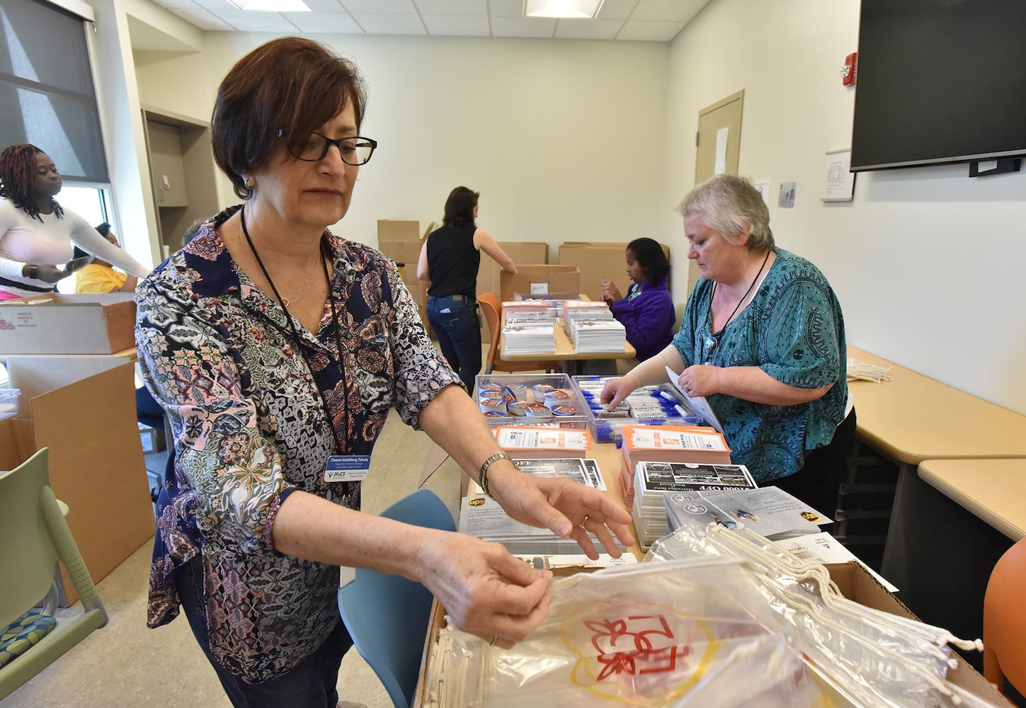 Volunteers prepare for the AJC Peachtree Road Race