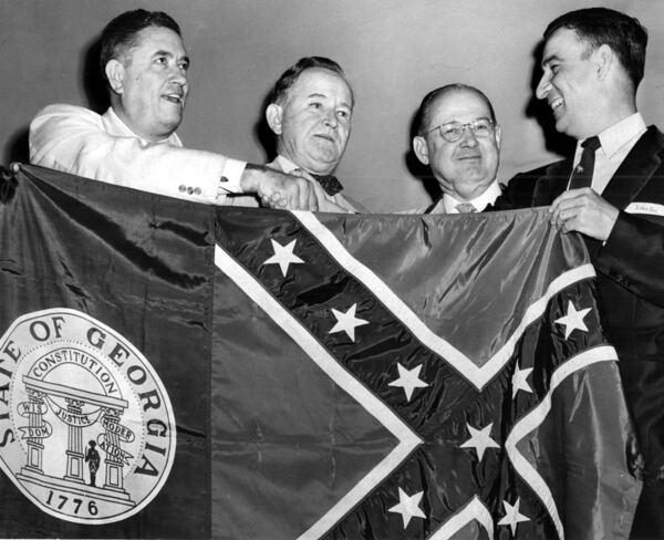 The Georgia state flag was changed Feb. 13, 1956, incorporating a Confederate battle emblem into the design, as a response to the Supreme Court rulings on desegregating schools. The original 1956 caption for this photo reads "Two Georgia Democrats, at left, Frank Etheridge and Judge Gus Roan, present a new state flag to Republicans Ray Spitler and W.B. Shartzer to take to the GOP national convention at San Francisco. Shartzer promised to display the banner with its Confederate symbol."