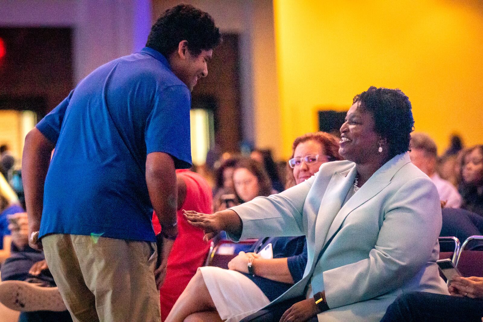 Gubernatorial candidate Stacey Abrams talks with people from the crowd before speaking at the Democratic Party of Georgia’s State Convention in Columbus on Saturday, August 27, 2022. (Photo: Steve Schaefer / steve.schaefer@ajc.com)