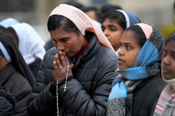 Nuns pray for Pope Francis in front of the Agostino Gemelli Polyclinic, where the Pontiff has been hospitalized since Feb.14, in Rome, Saturday, March 1, 2025. (AP Photo/Kirsty Wigglesworth)