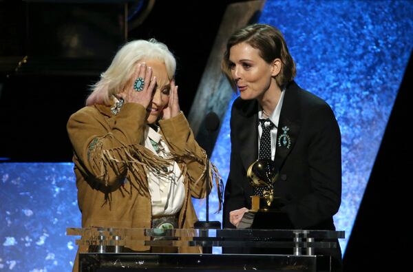 Tanya Tucker, left, and Brandi Carlile accept the award for best country song for "Bring My Flowers Now" at the 62nd annual Grammy Awards on Sunday, Jan. 26, 2020, in Los Angeles. (Photo by Matt Sayles/Invision/AP)