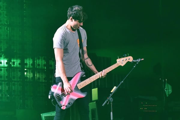 Calum Hood rocks some bass. Photo: Kate Teegardin/Special to the AJC.