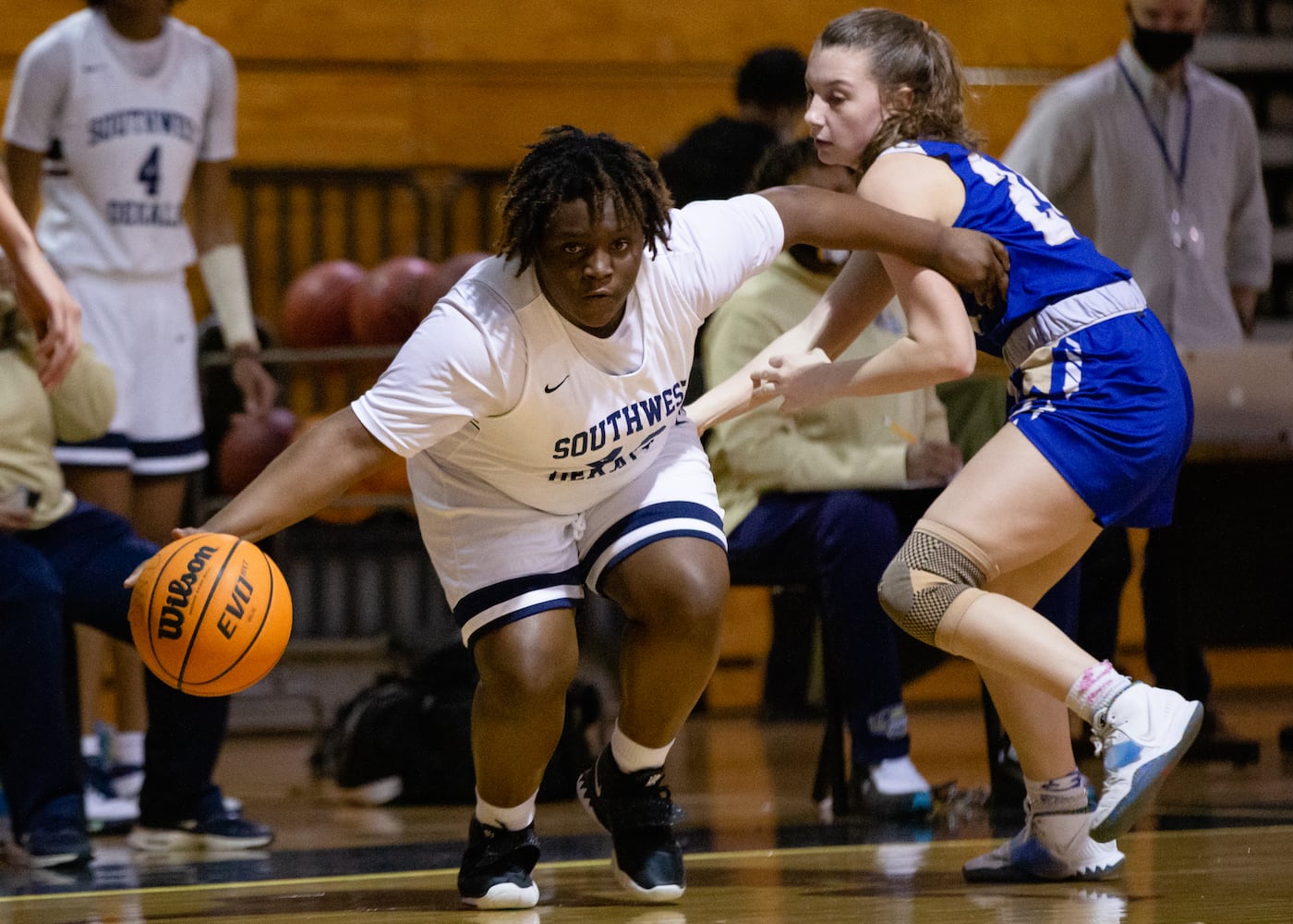 Jones Jayla (40), small forward for South Dekalb High School, is defended by Gracie Elkins (24), guard for Cass High School, during the South Dekalb vs. Cass girls basketball playoff game on Friday, February 26, 2021, at South Dekalb High School in Decatur, Georgia. South Dekalb defeated Cass 72-46. CHRISTINA MATACOTTA FOR THE ATLANTA JOURNAL-CONSTITUTION