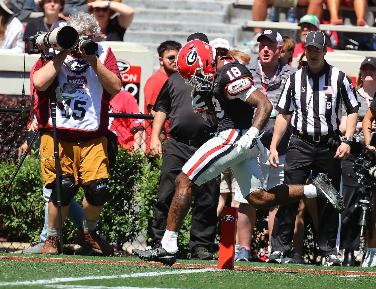 Wide receiver Sacovie White breaks away to the end zone for a touchdown to give the black team a 17-13 lead during the G-Day game on Saturday, April 13, 2024.  Curtis Compton for the Atlanta Journal Constitution