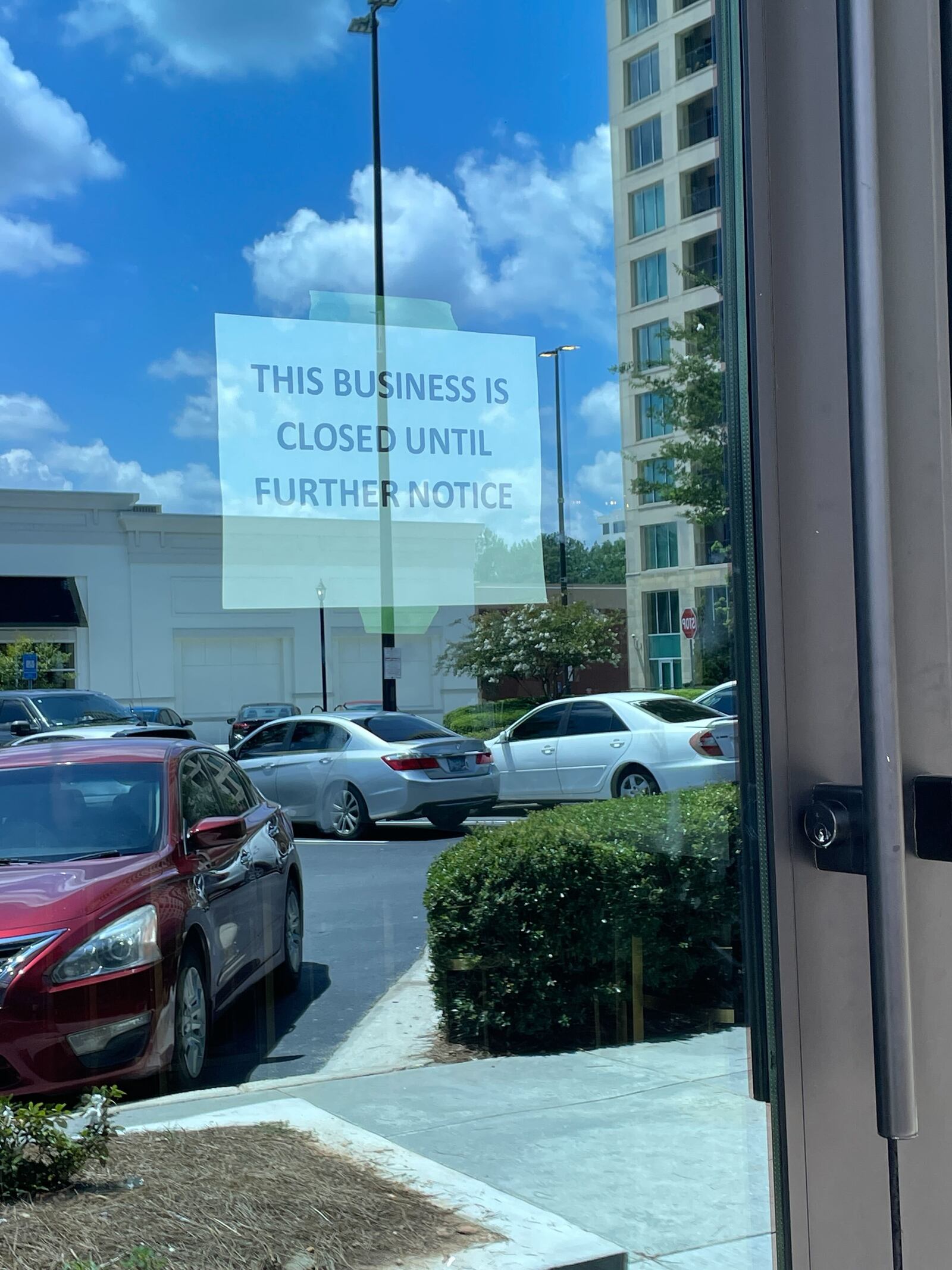 A sign on the door at The Hall at Ashford Lane. / AJC staff photo