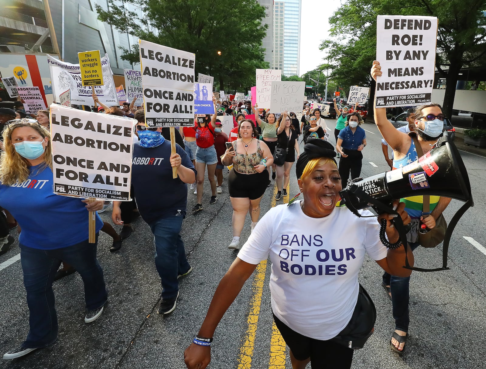 050322 Atlanta: Dozens of protesters march from Centennial Olympic Park to the Georgia Capitol during a rally to defend the right to abortion on Tuesday, May 3, 2022, in Atlanta.    “Curtis Compton / Curtis.Compton@ajc.com”