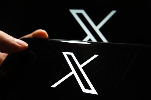 In a photo illustration, the Twitter "X" logo is displayed on the screen of a smartphone. (Sheldon Cooper/SOPA Images/Zuma Press/TNS)