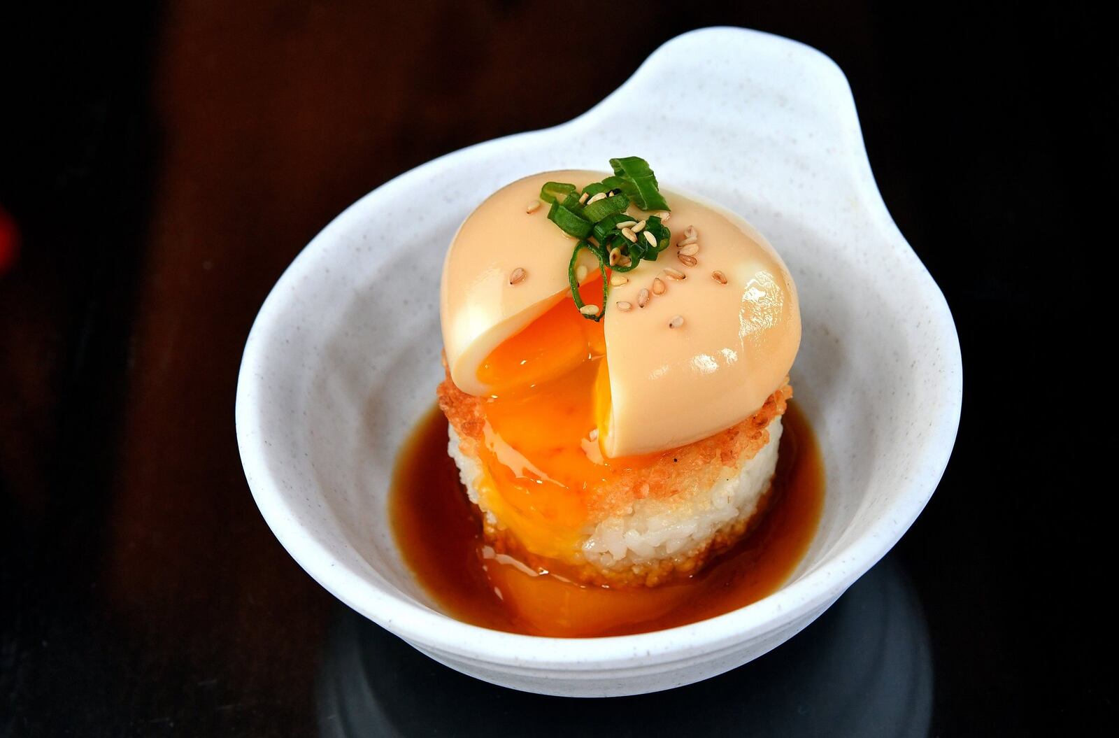 Shoyu Tomago, soft-boiled soy sauce egg, crispy rice cake, sweet soy vinaigrette. CONTRIBUTED BY CHRIS HUNT PHOTOGRAPHY