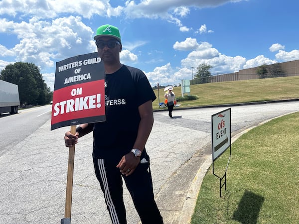 Brian Egeston, who wrote the recent Amazon Prime film "On a Wing and a Prayer" starring Dennis Quaid, is shown at a picket line outside OFS June 2, 2023. (Rodney Ho/rho@ajc.com)