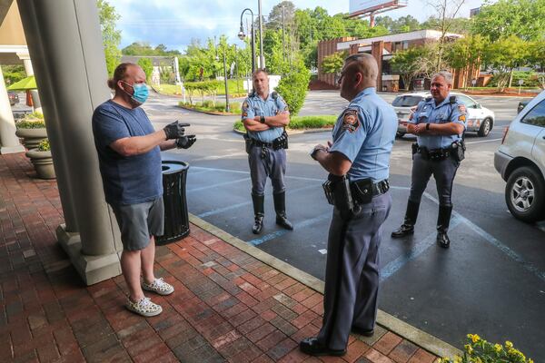 April 24, 2020 Atlanta: Barber and owner of Chris Edwards wears a mask (left) as he talks with GSP Troopers who were responding to a complaint call that there was a crowd gathering at the shop at Peachtree Battle Barber Shop at 2333 Peachtree Road in Atlanta on Friday, April 24, 2020. The Troopers found the business in compliance. The first phase of Gov. Brian KempÃ¢â¬â¢s plan to reopen Georgia during the coronavirus pandemic included haircut shops and gyms, though not all chose to open their doors. At Peachtree Battle Barber Shop in Buckhead, customers waited in line shortly after 7 a.m., Channel 2 Action News reported. Matt Maddox was one of those customers later Friday morning. Ã¢â¬ÅI certainly donÃ¢â¬â¢t want to spread it to anyone so IÃ¢â¬â¢ve got a mask, but IÃ¢â¬â¢m not really concerned,Ã¢â¬Â Maddox said. Ã¢â¬ÅIf youÃ¢â¬â¢re cutting hair or youÃ¢â¬â¢re a waiter, you havenÃ¢â¬â¢t been working, so it helps get the economy started again.Ã¢â¬Â JOHN SPINK/JSPINK@AJC.COM