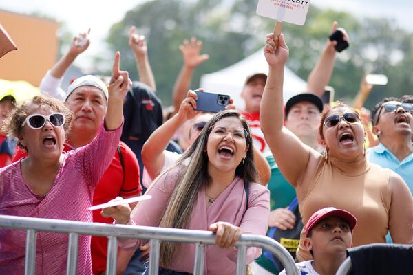 Elena Hernandez (center) sings along with the music from the band Eterfour during the Cinco de Mayo festival at Plaza Fiesta on May 7.
Miguel Martinez /miguel.martinezjimenez@ajc.com