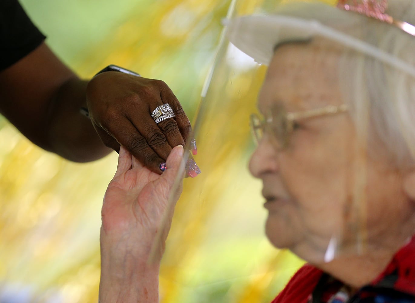 Photos: COVID-19 survivor celebrates 100th birthday