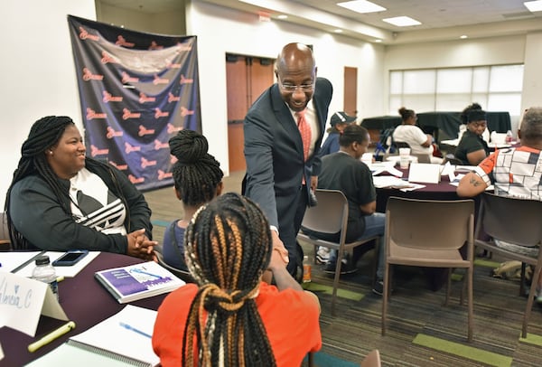 The Rev. Raphael Warnock greets participants during the Good Neighbor Program at Ebenezer Baptist Church on July 18, 2019. HYOSUB SHIN / HYOSUB.SHIN@AJC.COM