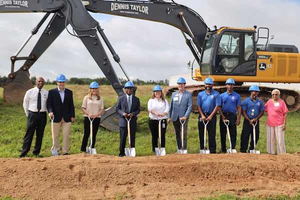 DeKalb County CEO Michael Thurmond (fourth from left) and other officials break ground on an expansion of PepsiCo's bottling plant in Tucker.