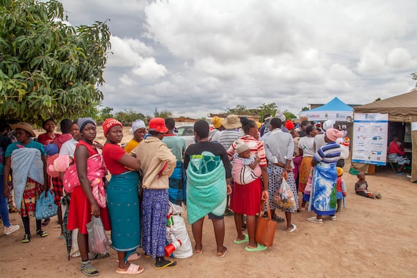 Women attend an outtreach clinic in Epworth, Zimbabwe, Thursday, Nov. 14, 2024. (AP Photo/Aaron Ufumeli)