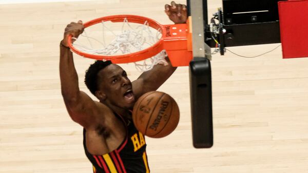 Hawks rookie forward Onyeka Okongwu (17) dunks against the Houston Rockets during the second half Sunday, May 16, 2021, at State Farm Arena in Atlanta. The Hawks won the regular season finale 124-95. (Ben Gray/AP)