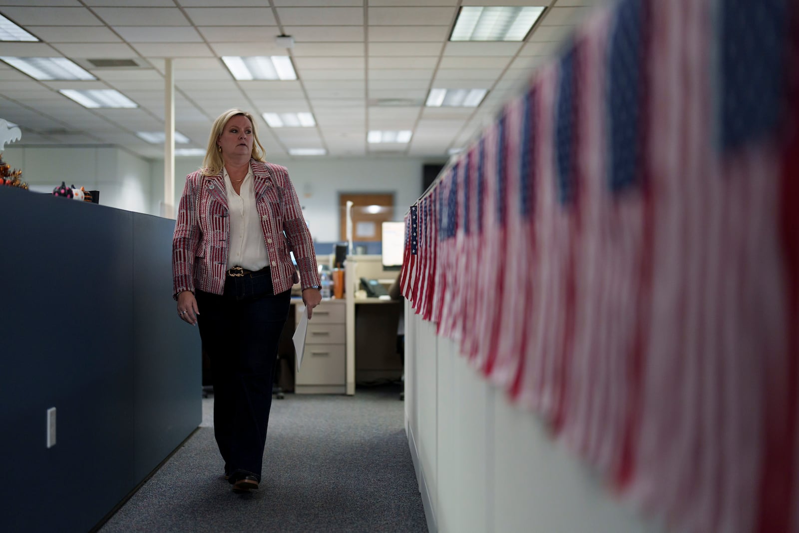 Cari-Ann Burgess, interim Registrar of Voters for Washoe County, Nev., walks through the office Friday, Sept. 20, 2024, in Reno, Nev. (AP Photo/John Locher)