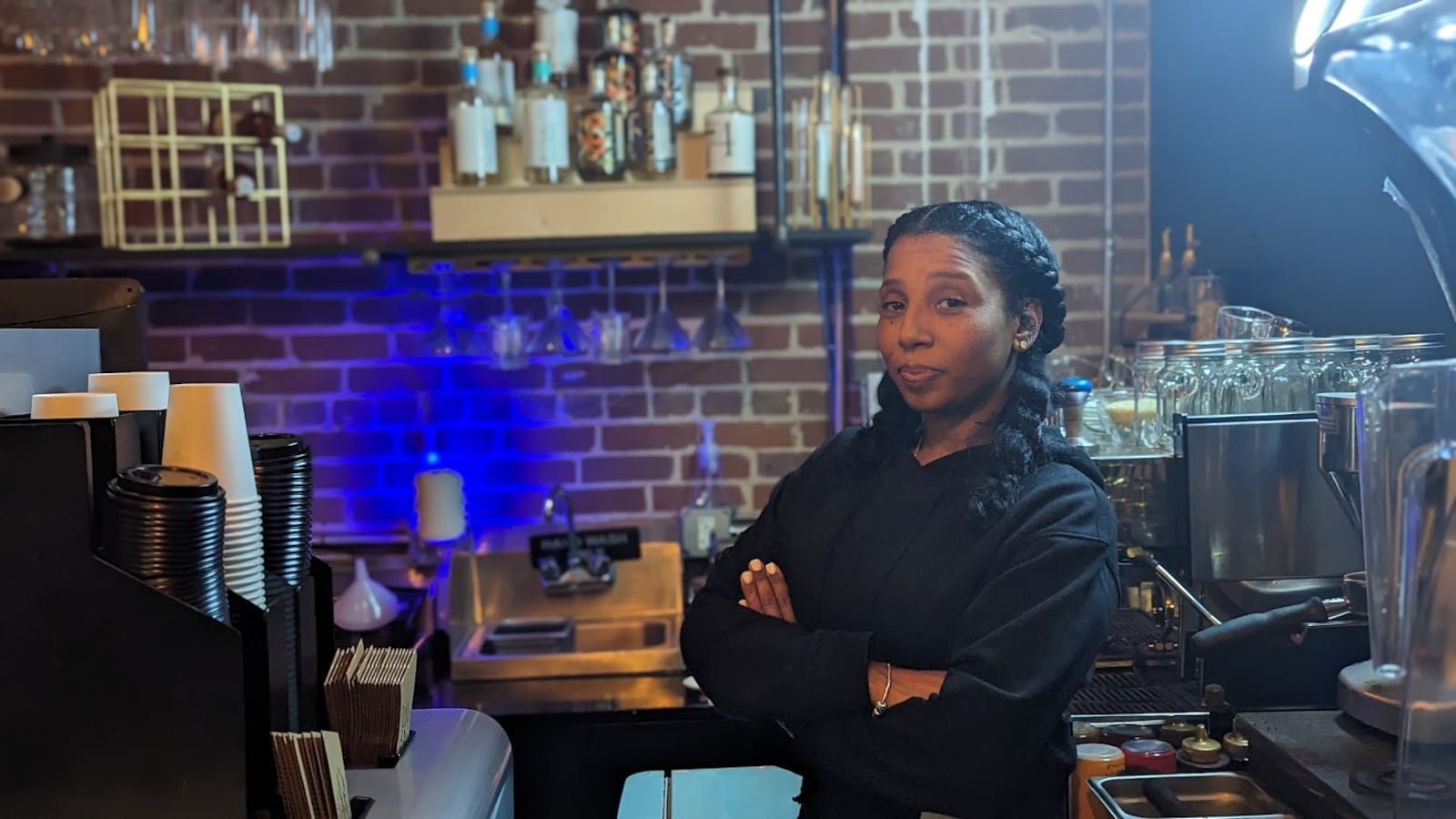 Aja Wolfe, owner of the Sober Social, stands behind the bar on Wednesday, November 15.