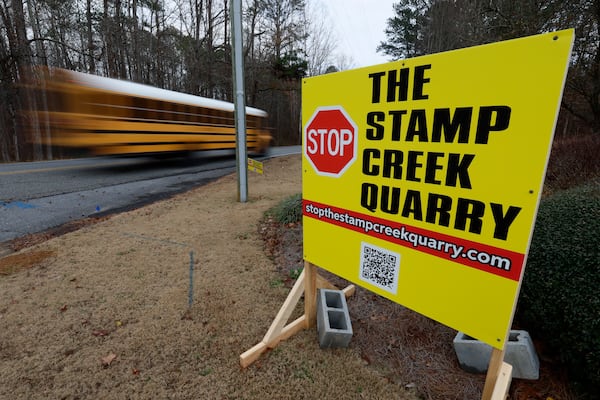 A sign outside the North Hampton subdivision on Stamp Creek Road in Cartersville shows that some residents oppose the controversial development of the Planned Greenspace and Development District, which would allow millions of square feet of industrial space, 16,500 residences, hundreds of acres of commercial development and 500 acres of mining. Miguel Martinez/AJC