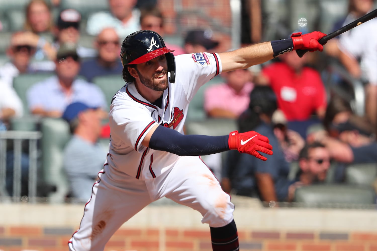 October 11, 2021 Atlanta: Atlanta Braves shortstop Dansby Swanson hits a single during the fifth inning against the Milwaukee Brewers in Game 3 of the NLDS on Monday, October, 11, 2021, in Atlanta. Curtis Compton / Curtis.Compton@ajc.com