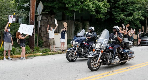 6/6/20 - Atlanta - Protestors lined N. Highland Avenue in Atlanta for a rally and protest organized for kids and families. Car horns blared in support as several hundred protestors spaced themselves along the street.    Bob Andres / bandres@ajc.com