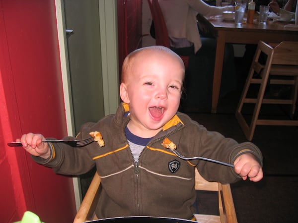 A two-year-old in 2006, Marcus Johnson, a frequent visitor at his parents’ West Egg Cafe, was a two-fisted consumer of the cafe's waffles.
(Courtesy of Ben Johnson)