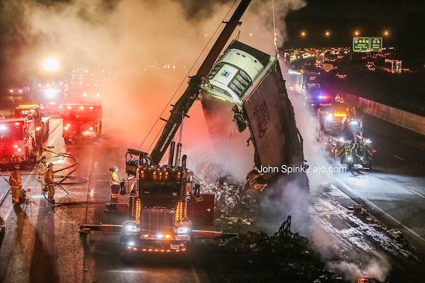 Authorities brought in a small crane to aid in firefighting efforts. 