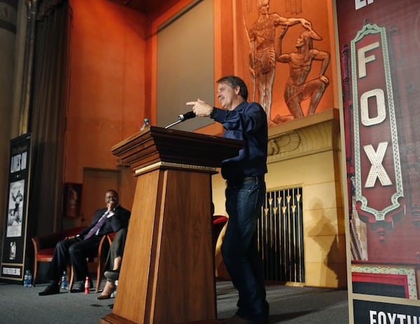 Jeff Foxworthy reminisces about the Fox as Mayor Kasim Reed looks on. The two spoke Tuesday about the preservationist movement in Atlanta, which began 40 years ago with the Save the Fox campaign. BOB ANDRES / BANDRES@AJC.COM