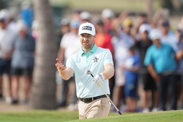 Brian Campbell, of the United States, reacts after his shot from a bunker on the 18th hole during the final round of the Mexico Open golf tournament in Puerto Vallarta, Mexico, Sunday, Feb. 23, 2025. (AP Photo/Fernando Llano)