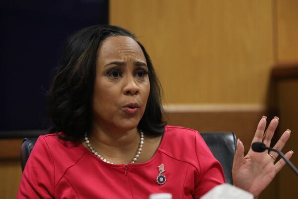 Fulton County District Attorney Fani Willis testifies during a hearing in the case of the State of Georgia v. Donald John Trump at the Fulton County Courthouse on Thursday, Feb. 15, 2024, in Atlanta. Judge Scott McAfee is hearing testimony as to whether Willis and Special Prosecutor Nathan Wade should be disqualified from the case for allegedly lying about a personal relationship. (Alyssa Pointer/AJC)