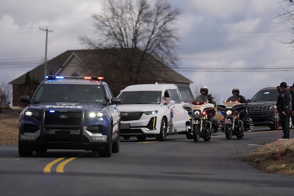 The remains of West York Borough Police Officer Andrew Duarte, arrive for his funeral at Living Word Community Church, in Red Lion, Pa., Friday, Feb. 28, 2025. (AP Photo/Matt Rourke)