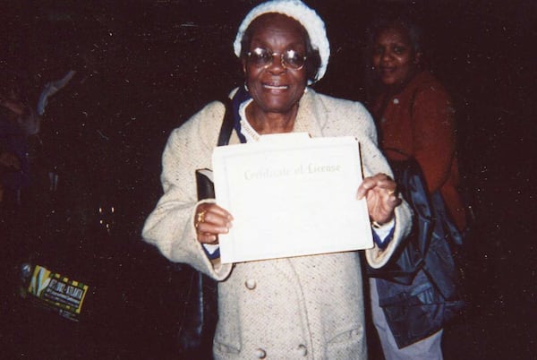 Emma Rowland posing with certificate she'd just revived when ordained as a minister by Austell's Bishop Dale Bronner. Photo courtesy of Rowland's granddaughter Cheryl Pope Clark.