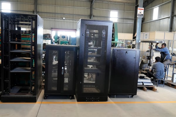 Large steel chassis made for data centers are ready for shipment at a factory in a suburb of Bengaluru, India, Thursday, Feb. 27, 2025. (AP Photo/Aijaz Rahi)