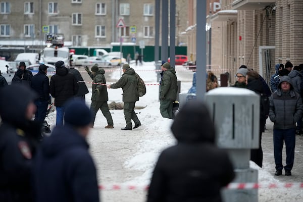 Investigates work at the place where Lt. General Igor Kirillov, the head of Russia's Nuclear, Biological, and Chemical Defence Forces was killed by an explosive device planted close to a residential apartment's block in Moscow, Russia, Tuesday, Dec. 17, 2024. (AP Photo)