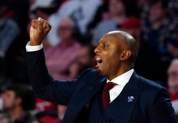 Memphis head coach Penny Hsrdaway directs his players from the bench during the second half of an NCAA college basketball game against Georgia Wednesday, Dec. 1, 2021, in Athens, Ga. (AP Photo/John Bazemore)