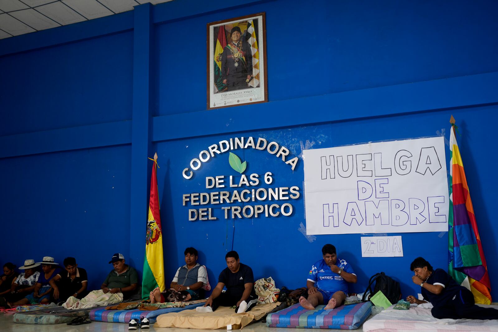 Former President Evo Morales, right, chews coca leaves during a hunger strike in Lauca N, Chapare region, Bolivia, Sunday, Nov. 3, 2024, amid an ongoing political conflict with the government of President Luis Arce. (AP Photo/Juan Karita)