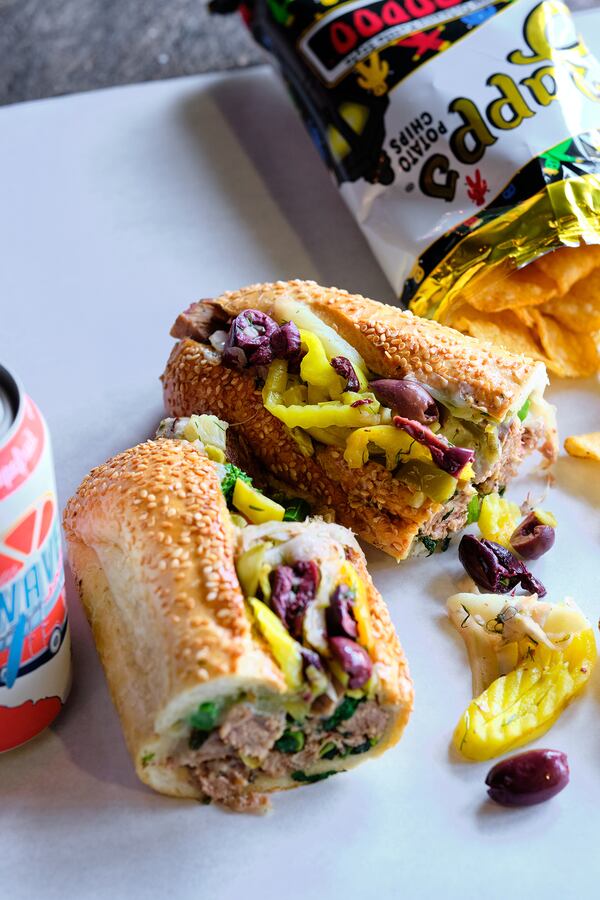 At the Best, you can get your Philly pork sandwich all-the-way with pickled garlic chips, banana peppers, hot giardiniera salad, marinated chopped olives and roasted bell peppers. Courtesy of Brandon Amato