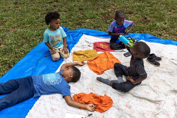 Children from Gather Forest School learn and play at a park in Atlanta on Thursday, June 30, 2022. (Arvin Temkar / arvin.temkar@ajc.com)