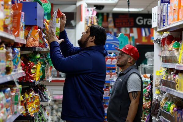 Marvin Hernandez, 30, owner of El Progreso Market on Buford Highway, organized items on shelves on Wednesday, January 29, 2025. Following the immigration arrests that began on Sunday, he reported a 30-40 percent decrease in sales.
(Miguel Martinez/ AJC)