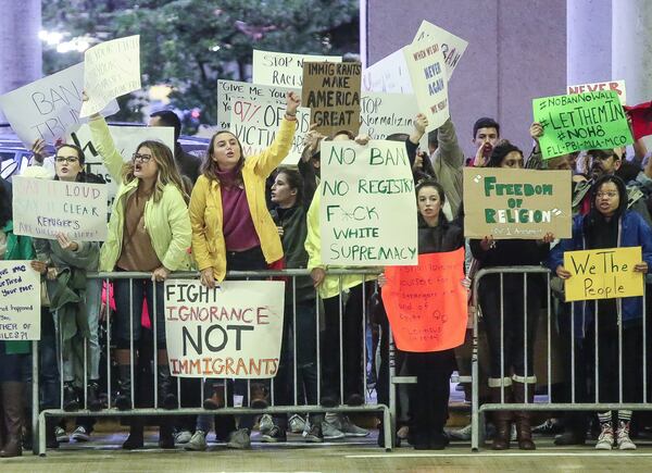 People protest against President Trump’s ban on immigrants returning from seven countries at the Palm Beach International Airport earlier this week.