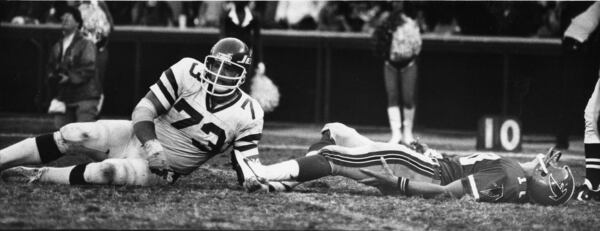 Steve Bartkowski is dumped by Joe Klecko of the Jets in 1980. (Louie Favorite / AJC staff)