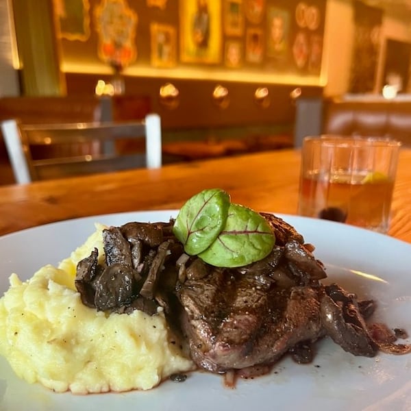 The woodsman-style filet mignon at Kindred comes topped with a variety of smoked mushrooms and sorrel. Courtesy of Rebecca Cochran